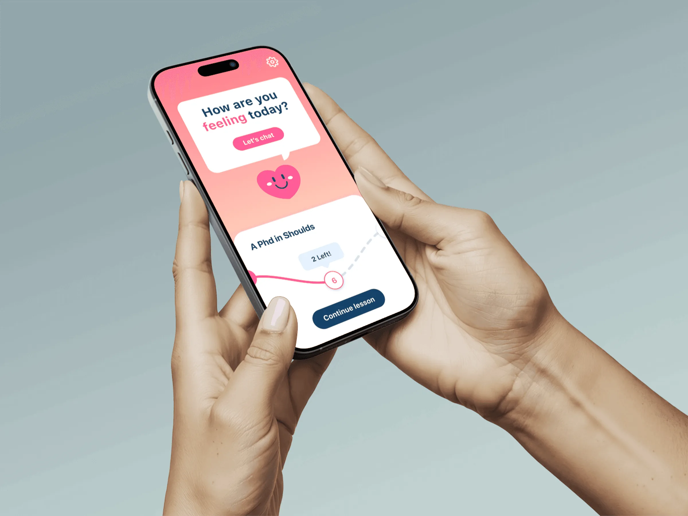 A hand holding a phone showing the Feeling Good app: a pink screen that asks how you are feeling today.